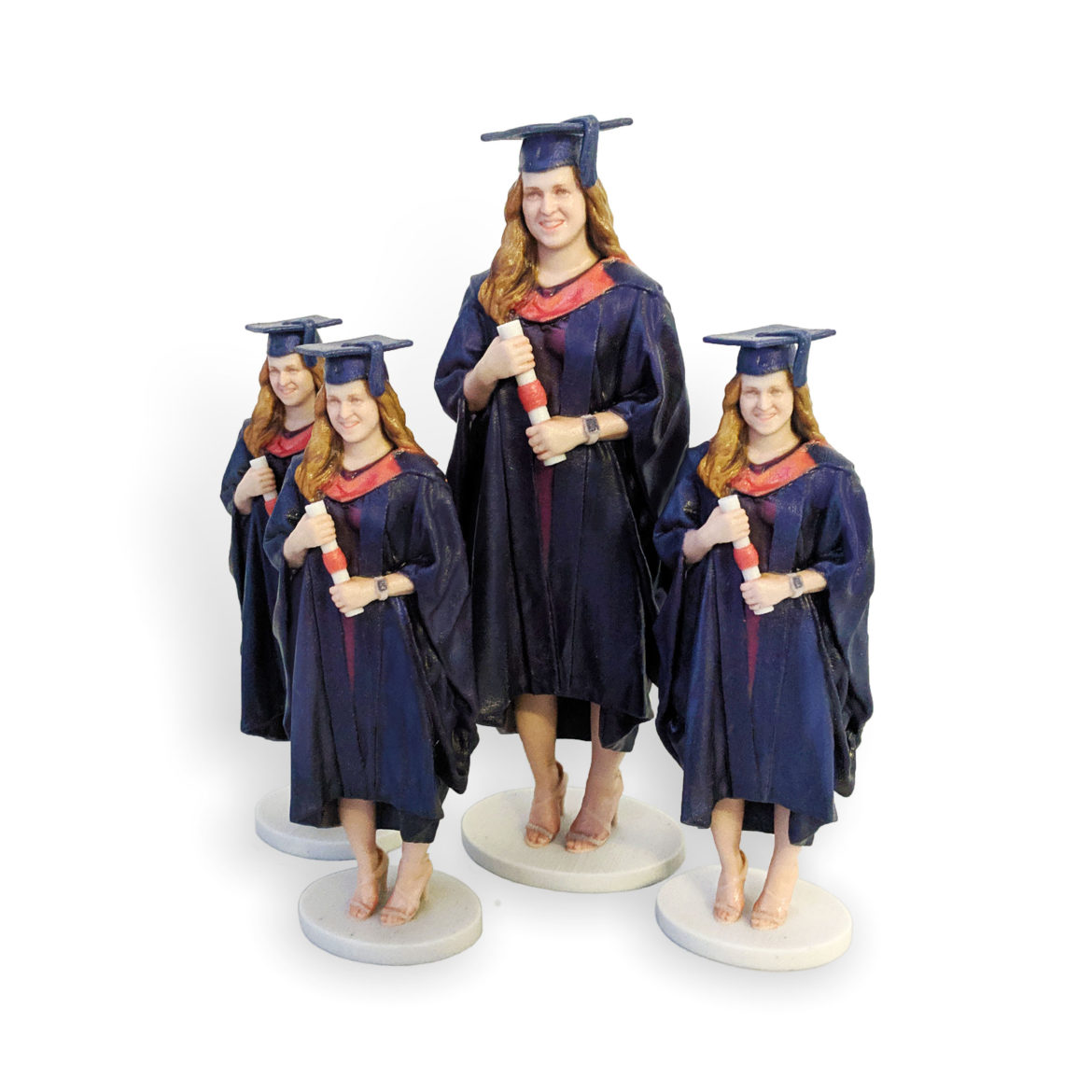 my3Dtwin, four 3D Printed Graduation Figurines in blue gown and scroll in hands